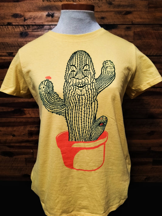 Yellow t-shirt with a cactus graphic on a mannequin against a wooden background